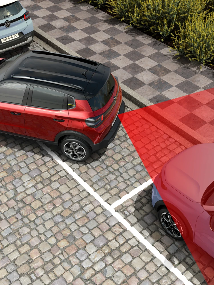 Widok z góry Citroëna ë-C3 elektrycznego SUV-a pokazujący tylne czujniki parkowania dla bezpieczniejszego, pewnego i przystępnego manewrowania w mieście.