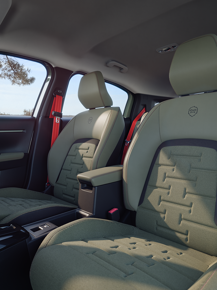 Widok przednich foteli Citroëna ë-C3 Aircross, ukazujący fotele Advanced Comfort i ergonomiczną konstrukcję zapewniającą komfort podczas rodzinnych podróży