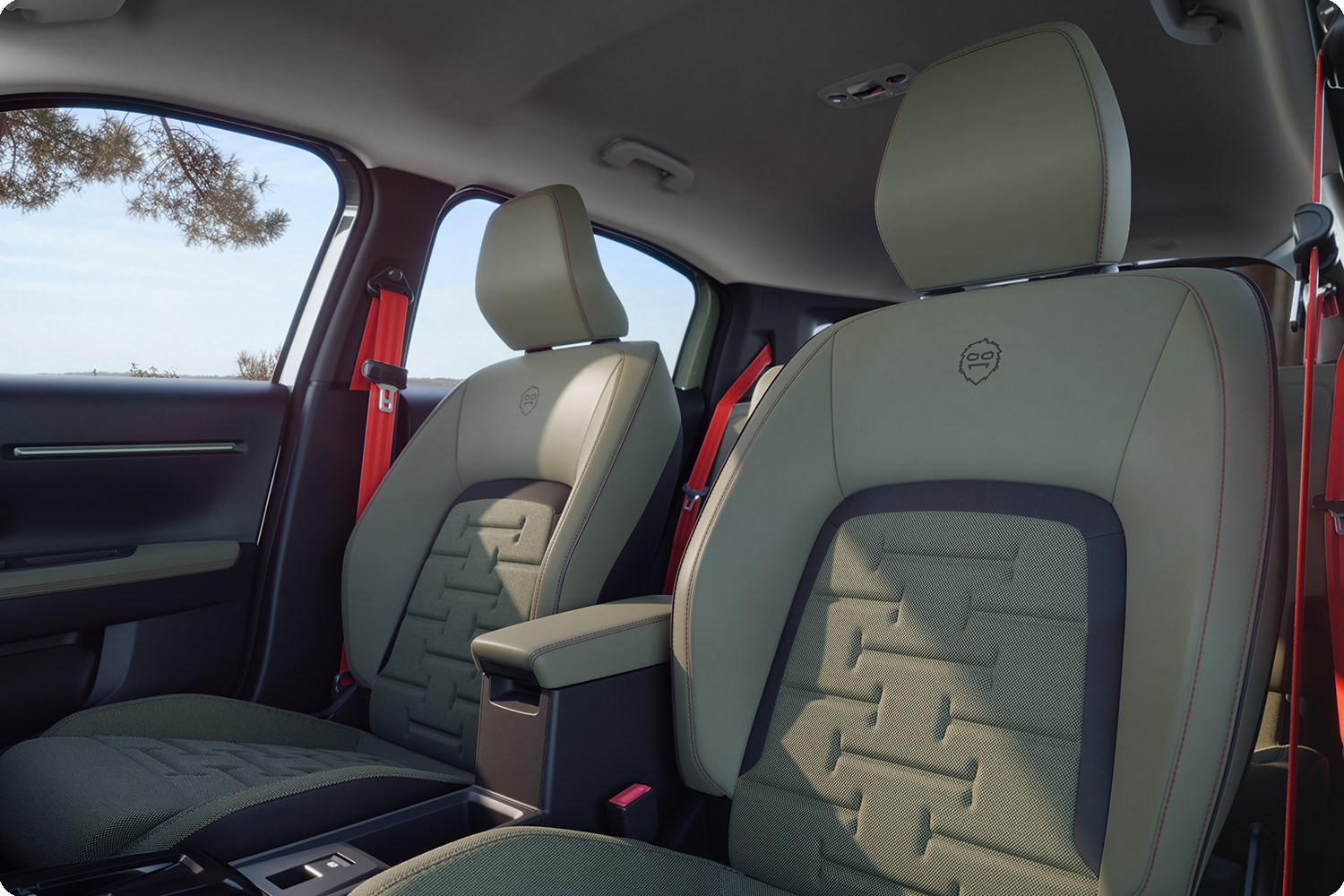 Zbliżenie na tylne siedzenia Citroëna C3 Aircross Outdoor z czerwonymi pasami bezpieczeństwa, zapewniające komfort i przestronność oraz wyróżniające się świeżym designem